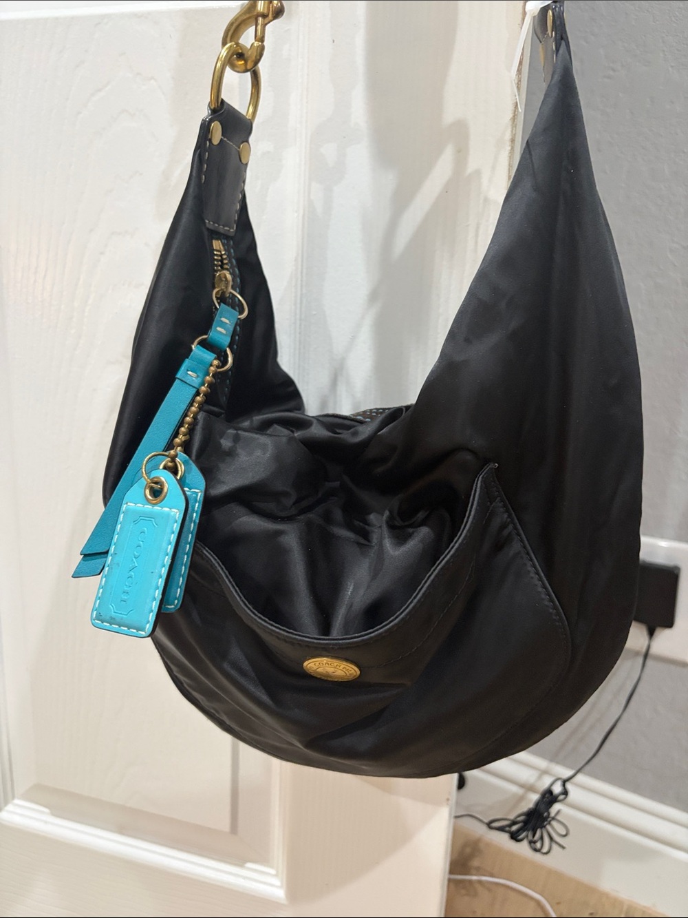Coach Black Hobo Bag with Turquoise Tag Accent